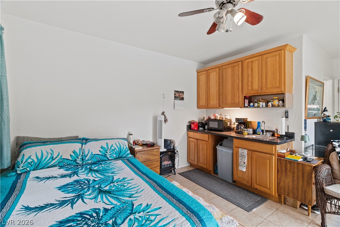 2516 Morrow Ridge Place Laughlin, NV 89029 - Photo 42 of 93 Casita / Guest Quarters Bedroom with a ceiling fan and light tile patterned floors
