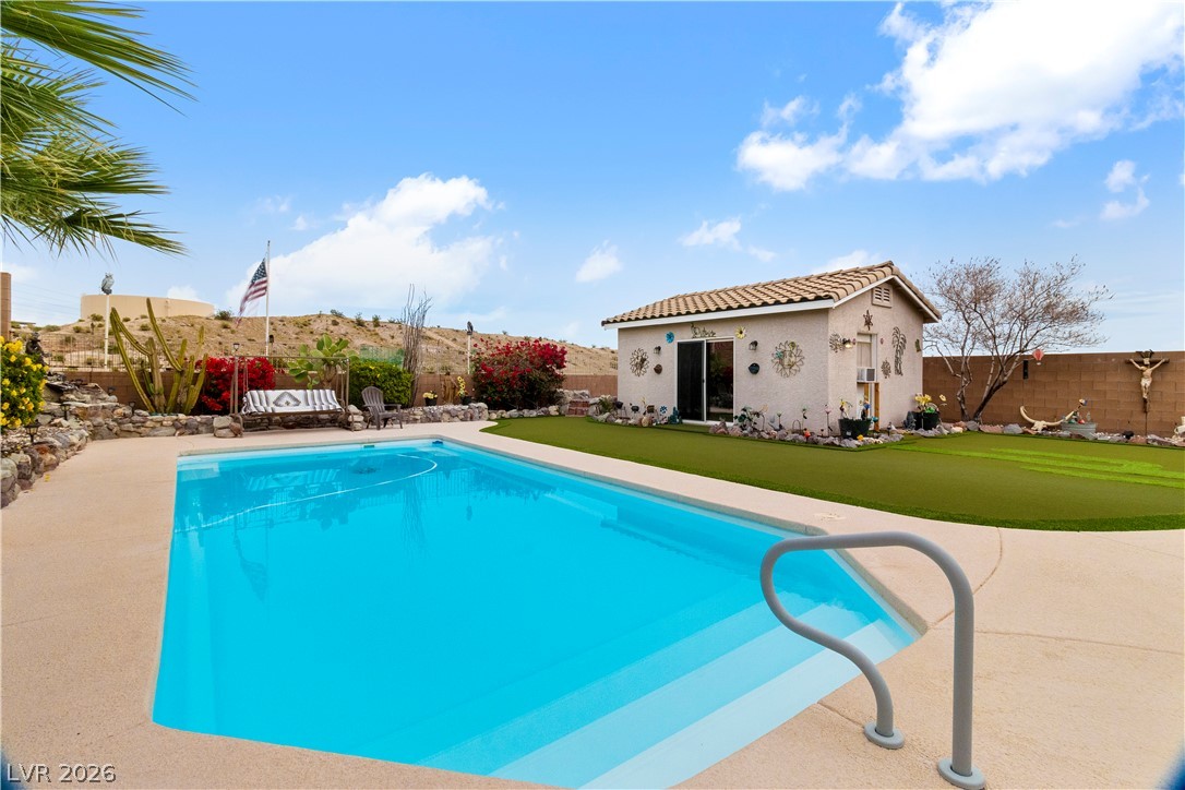 2516 Morrow Ridge Place Laughlin, NV 89029 - Photo 61 of 93 View of swimming pool with an outbuilding, a fenced backyard, patio surround, and an exterior structure