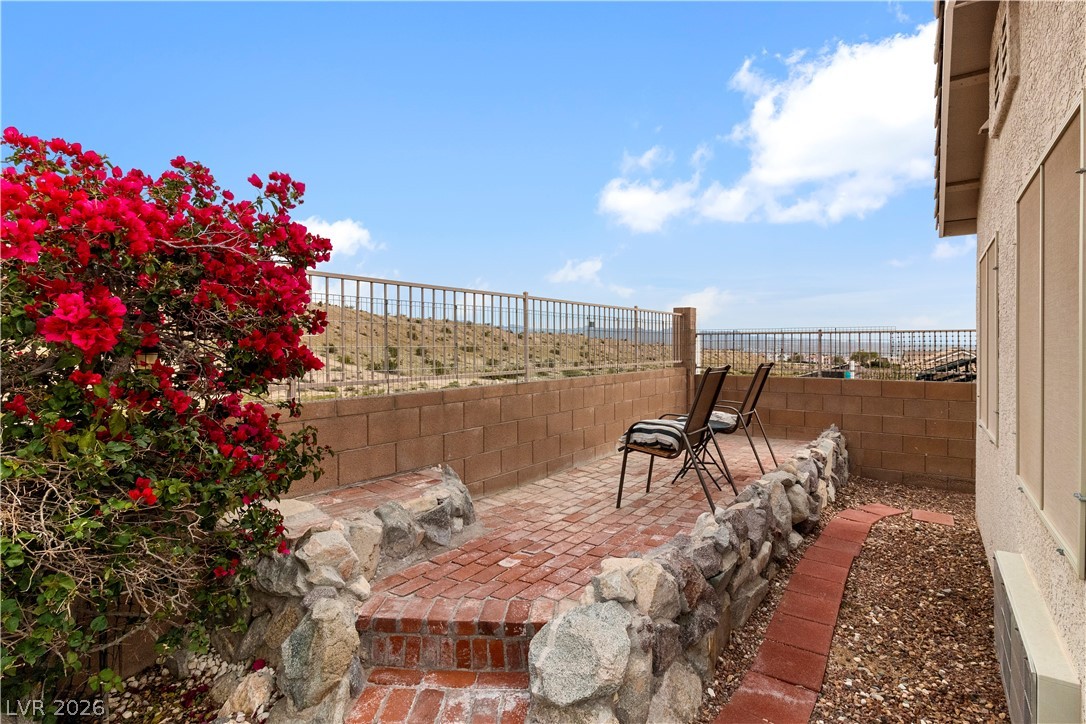 2516 Morrow Ridge Place Laughlin, NV 89029 - Photo 66 of 93 Behind the Guest Quarters is a brick paved raised patio with a view overlooking the desert behind the home