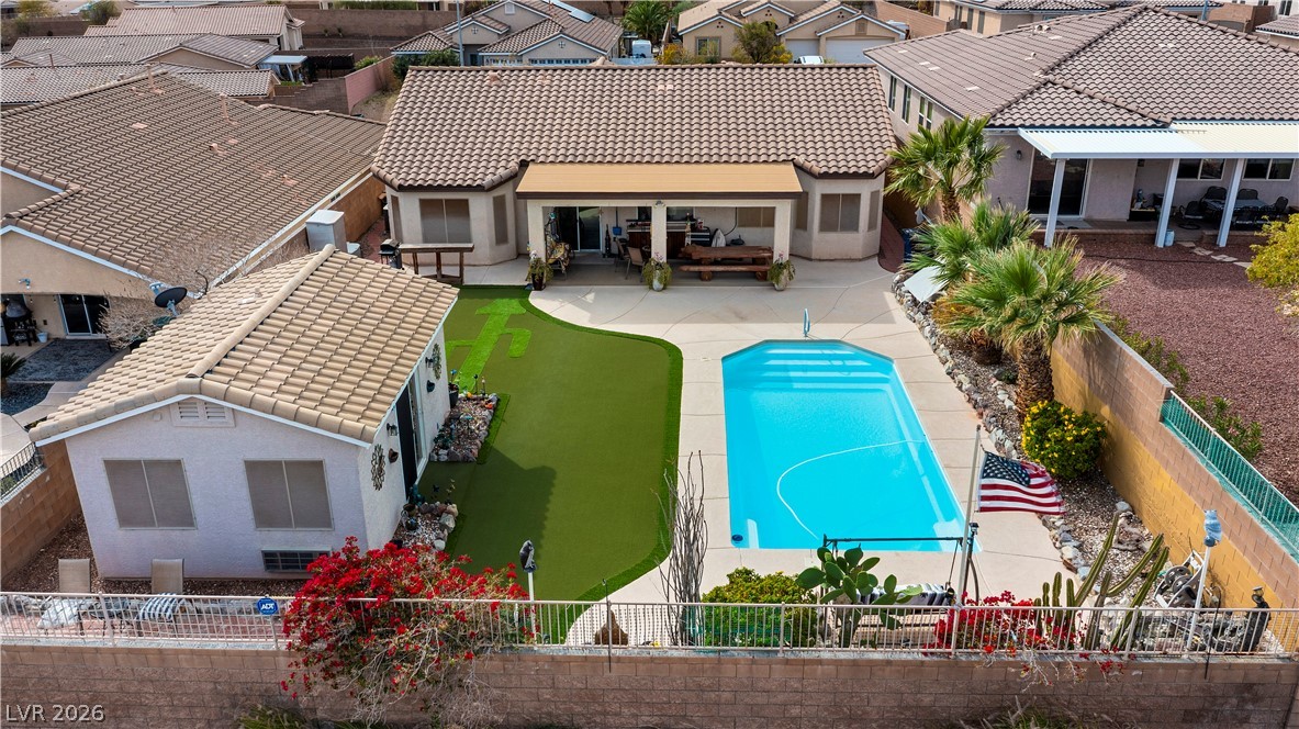 2516 Morrow Ridge Place Laughlin, NV 89029 - Photo 70 of 93 Backyard with Guest Quarters, Pool, Green turf, Covered Patio