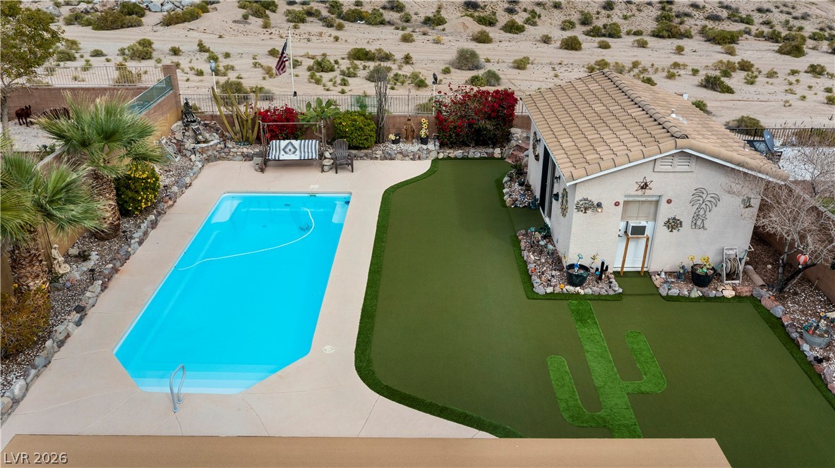 2516 Morrow Ridge Place Laughlin, NV 89029 - Photo 81 of 93 View of swimming pool with a fenced backyard, patio surround, and a putting green