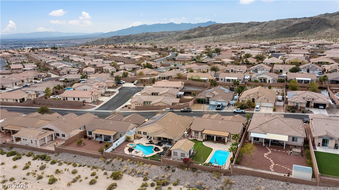 2516 Morrow Ridge Place Laughlin, NV 89029 - Photo 84 of 93 Aerial view of residential area with a pool area and a mountain backdrop