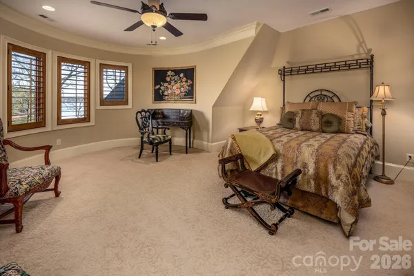 a bedroom with furniture and a window