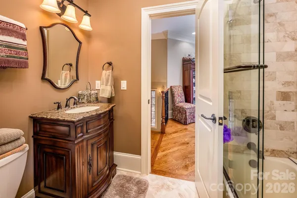 a bathroom with a sink vanity and a mirror