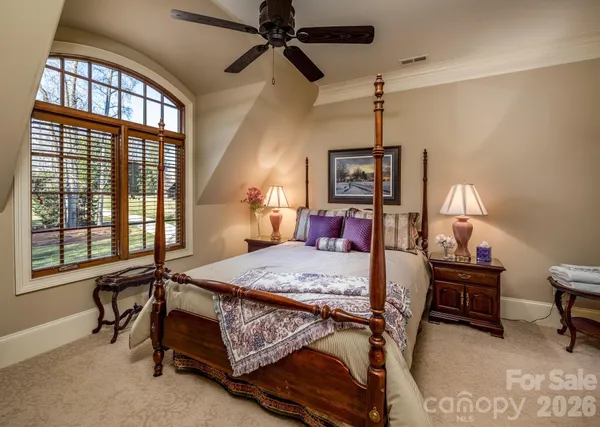 a bedroom with a bed a desk and chair