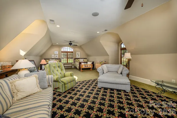 a living room with furniture and a rug