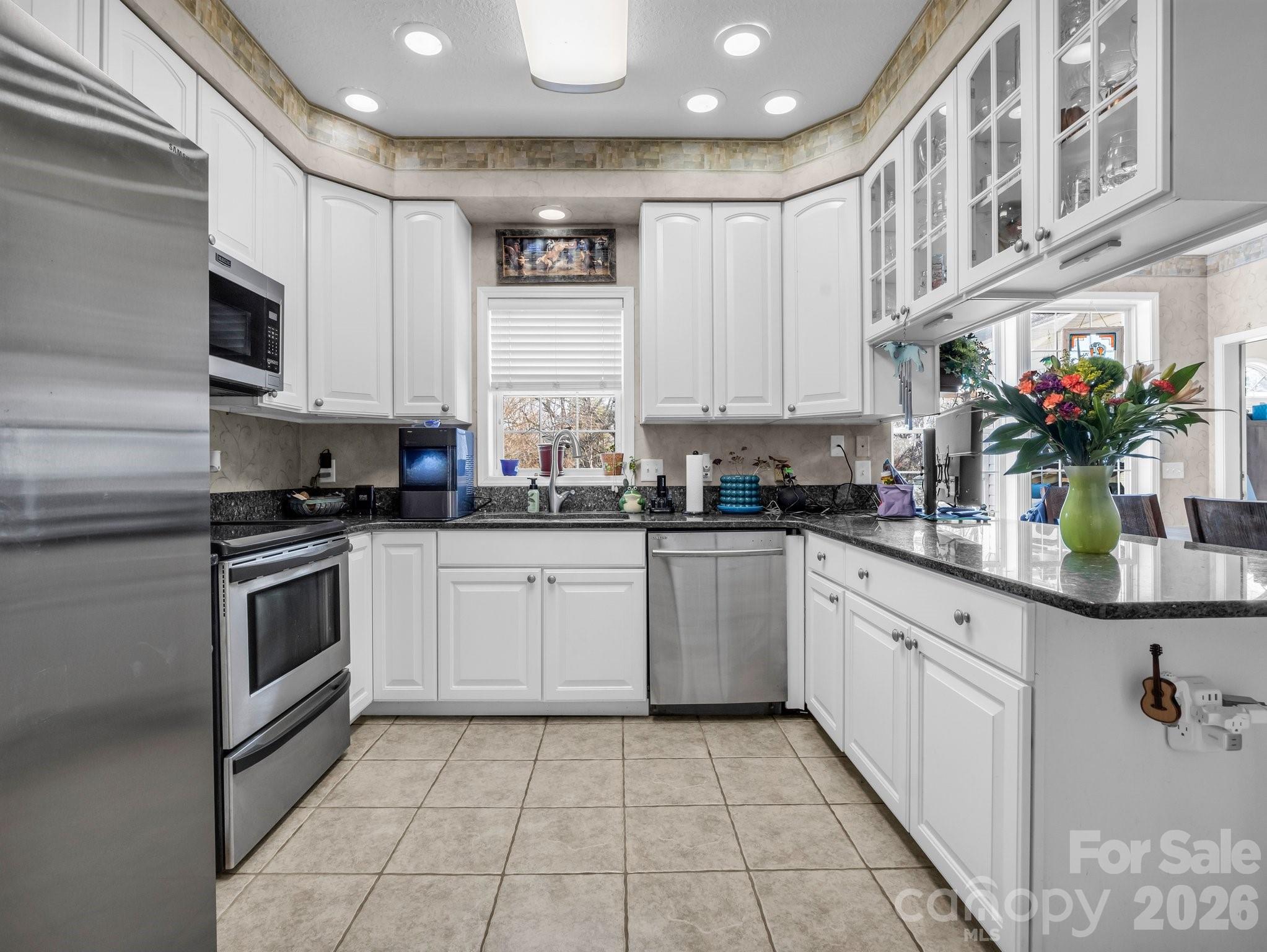 532 Harvey Logan Road Bostic, NC 28018 - Photo 30 of 48 a kitchen with a sink microwave and cabinets