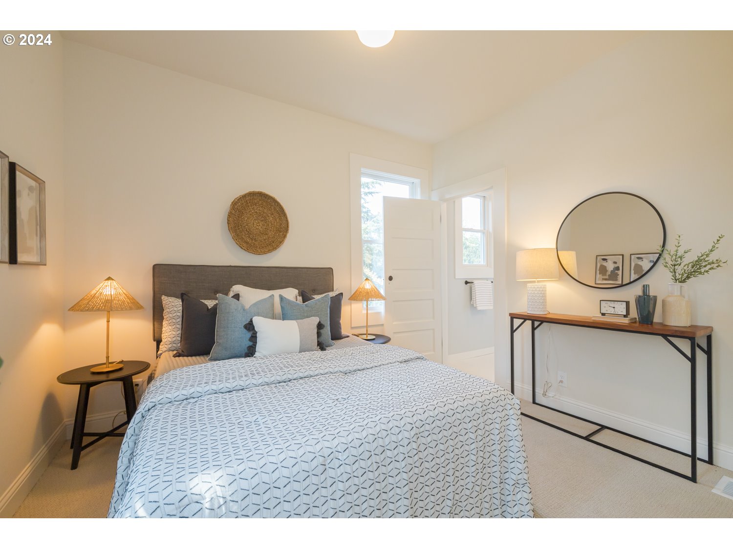 2707 Southwest Homar Avenue Portland, OR 97201 - Photo 11 of 48 a bedroom with bed and a chandelier