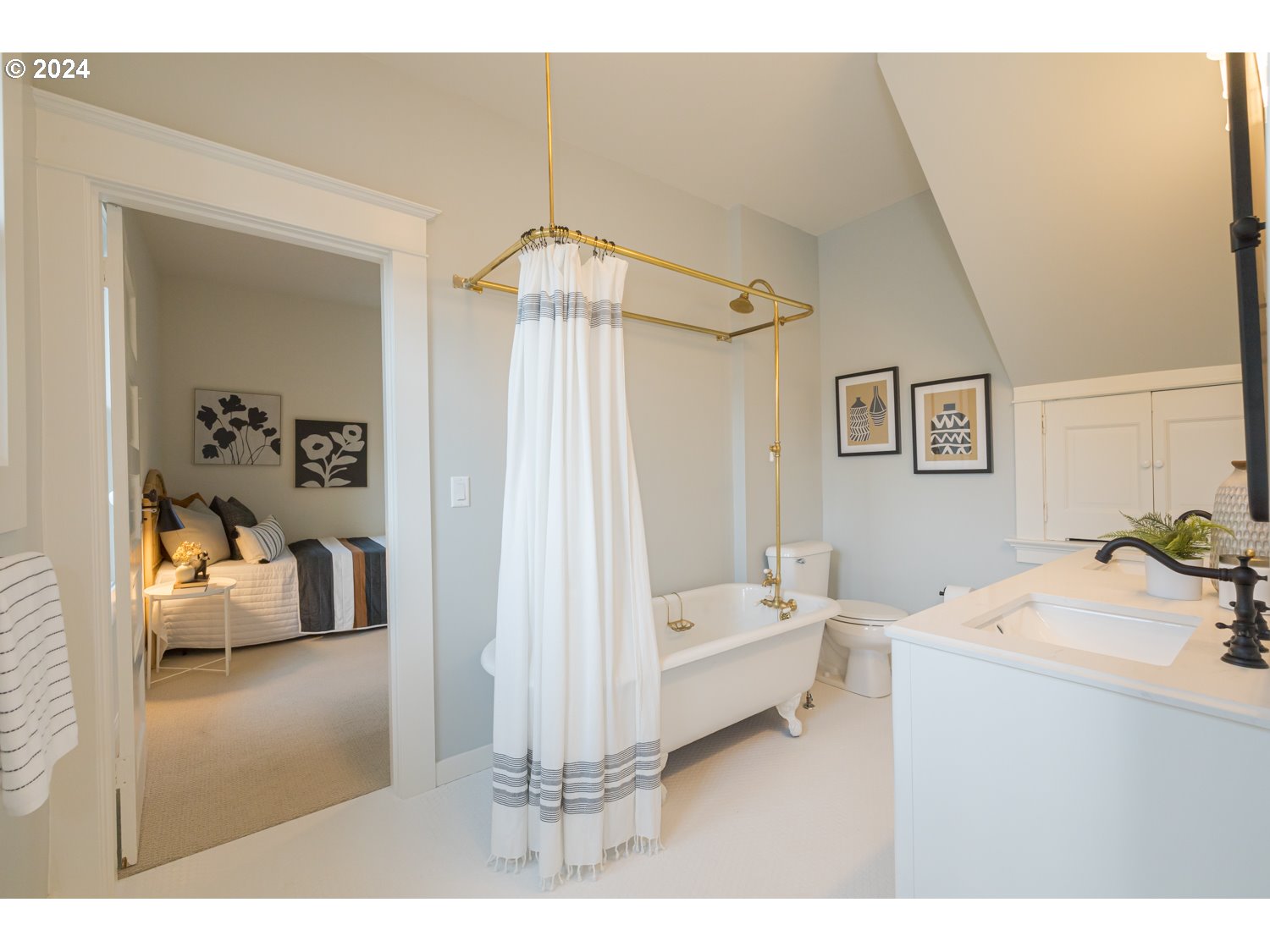 2707 Southwest Homar Avenue Portland, OR 97201 - Photo 14 of 48 a bedroom with a bed and a chandelier