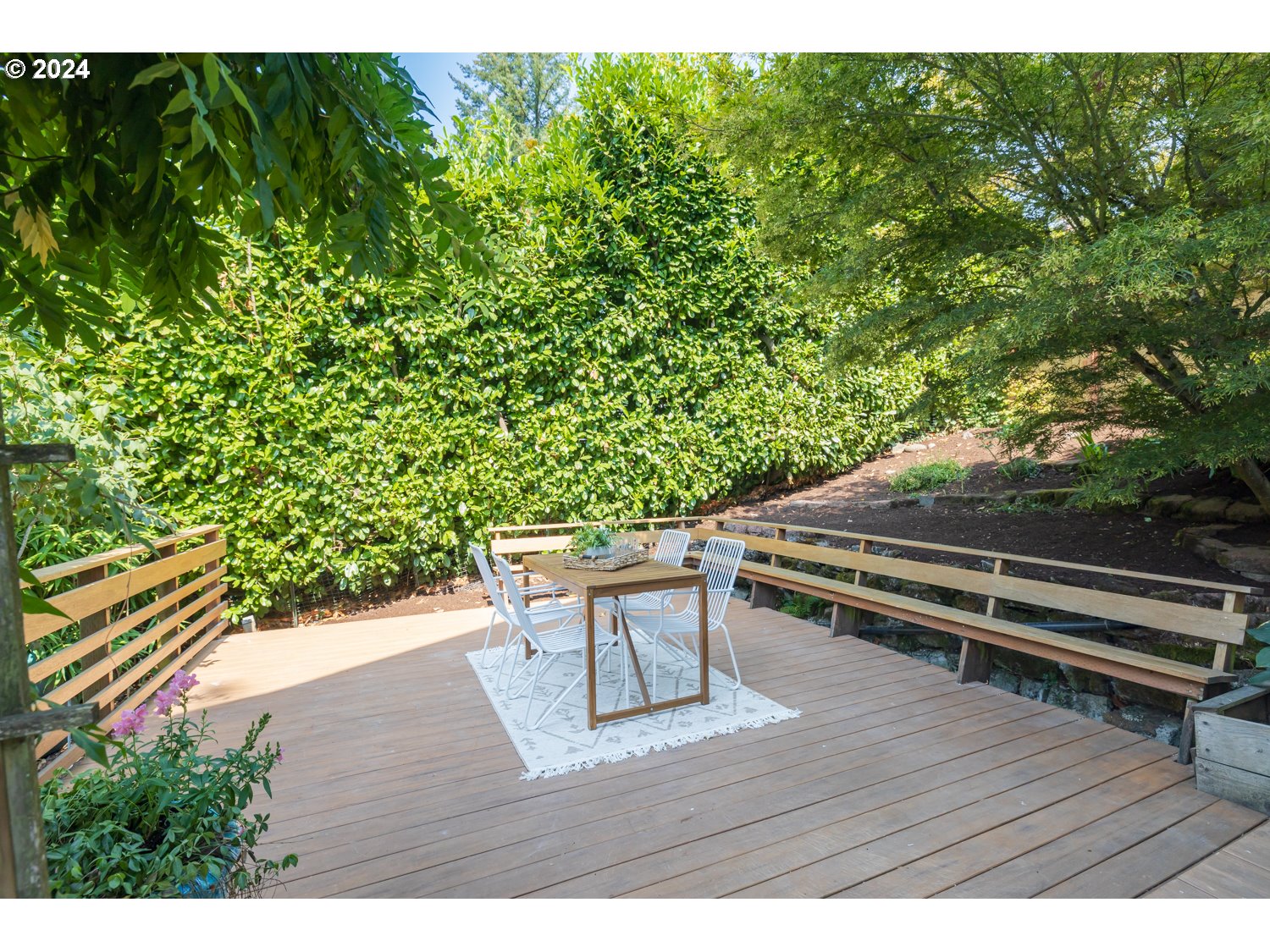 2707 Southwest Homar Avenue Portland, OR 97201 - Photo 37 of 48 a wooden bench sitting in the middle of a backyard