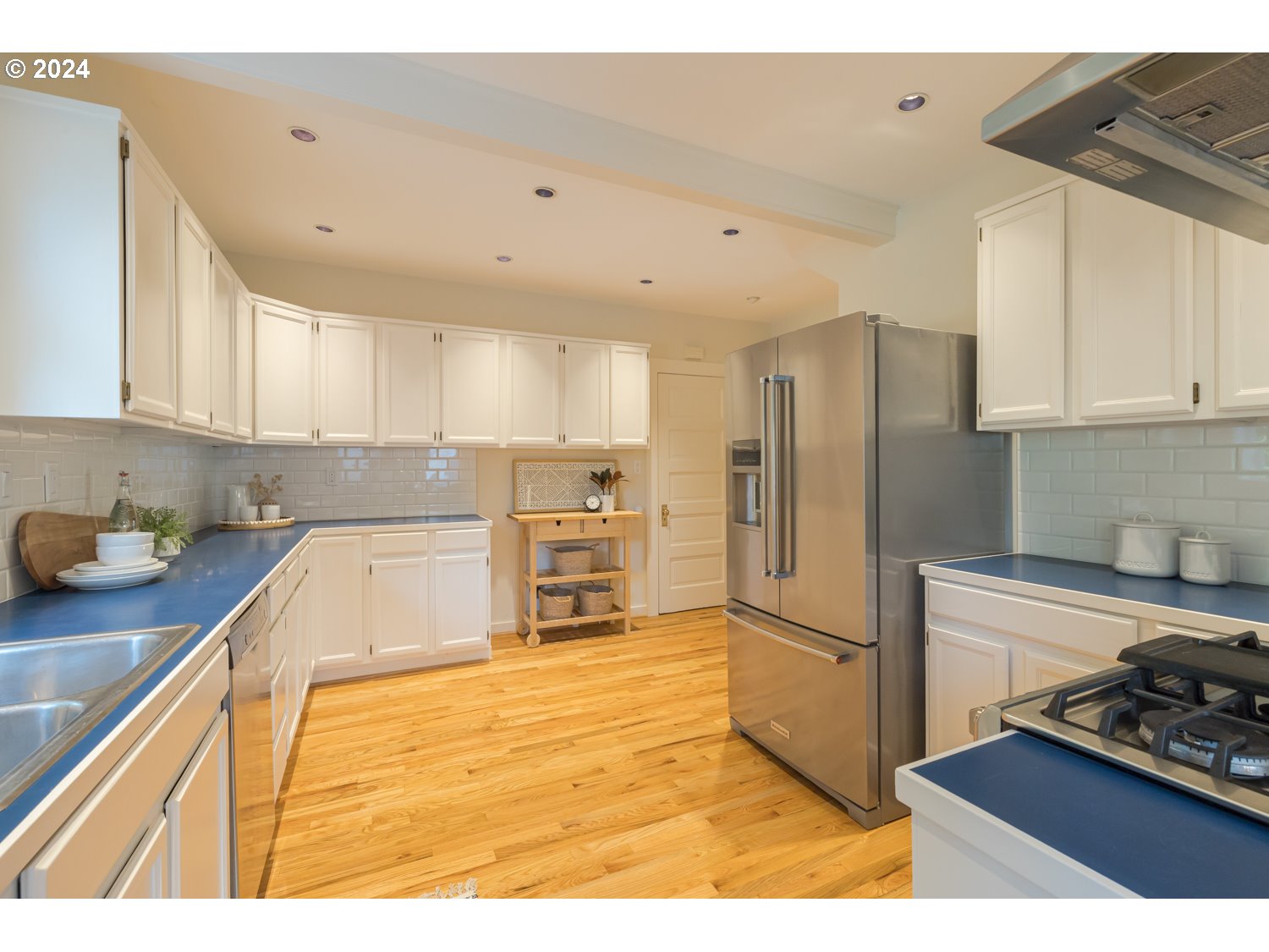 2707 Southwest Homar Avenue Portland, OR 97201 - Photo 42 of 48 a kitchen with granite countertop a refrigerator and a sink