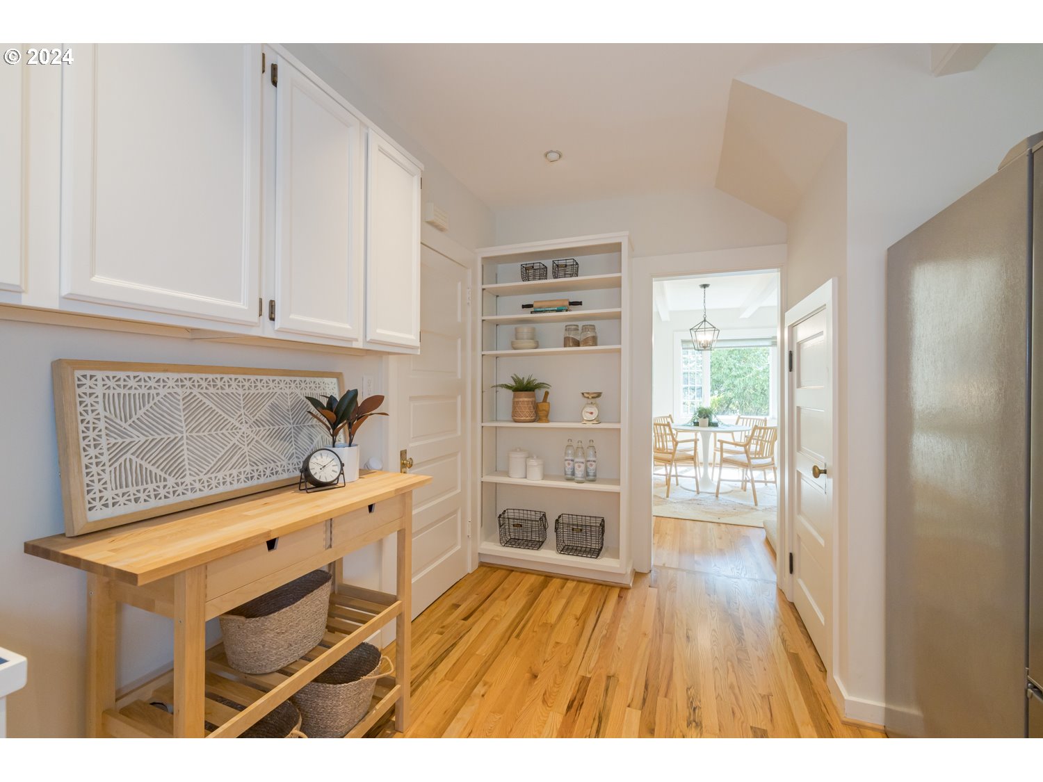 2707 Southwest Homar Avenue Portland, OR 97201 - Photo 45 of 48 a open kitchen with cabinets wooden floor and a fireplace