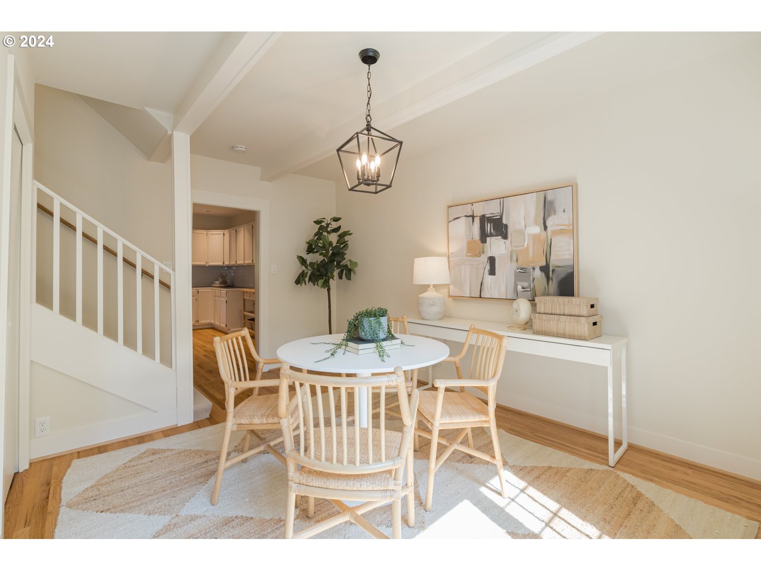 2707 Southwest Homar Avenue Portland, OR 97201 - Photo 46 of 48 a dining room with wooden floor a chandelier a wooden table and chairs