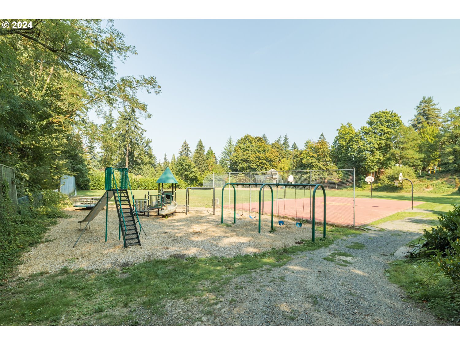 2707 Southwest Homar Avenue Portland, OR 97201 - Photo 47 of 48 a view of swimming pool with a garden and trees