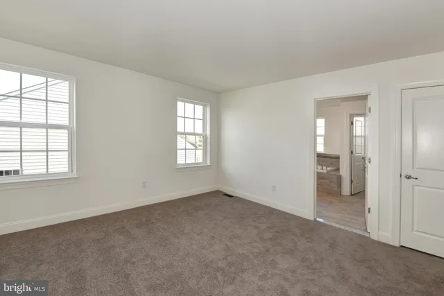 a view of an empty room and closet