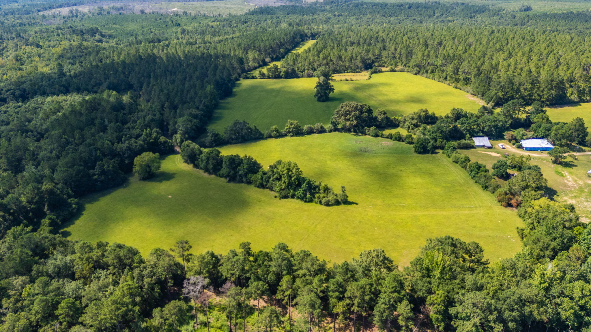 139-acres Yorkey Road Westville, FL 32464 - Photo 2 of 37 an aerial view of a residential houses with swimming pool and outdoor space