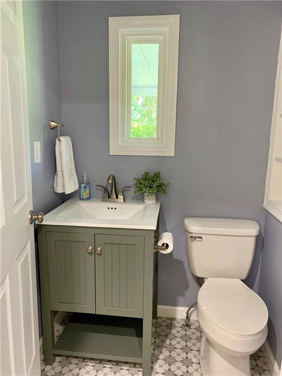 401 Bechman Street Springdale, PA 15144 - Photo 13 of 25 Quite the adorable 1/2 bath! Gutted and totally remodeled! Love that unique star ceramic tile flooring!