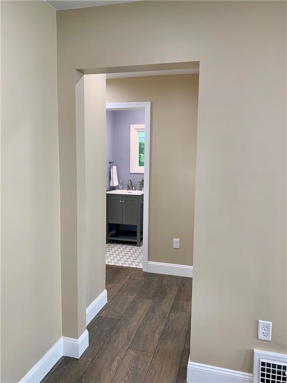 401 Bechman Street Springdale, PA 15144 - Photo 15 of 25 Entry from Living Room into hallway leading to main level bedroom and 1/2 bath!