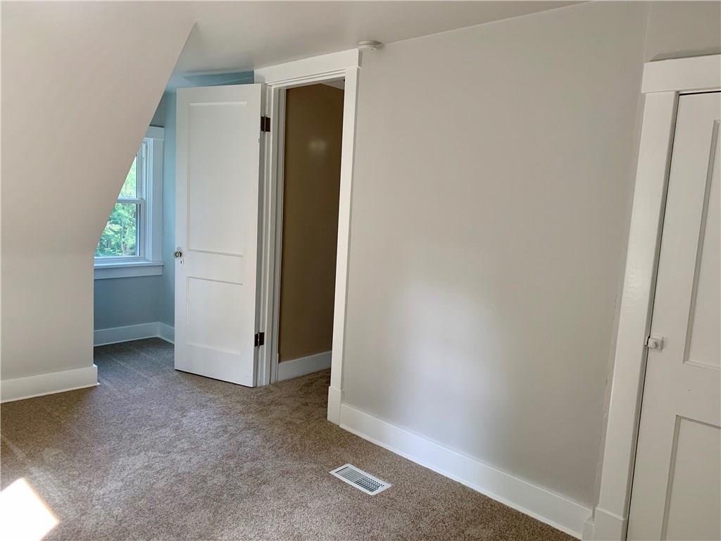 401 Bechman Street Springdale, PA 15144 - Photo 20 of 25 Upper Level 14x9 3rd Bedroom with new carpet/fresh paint/trim/lighting/window!
