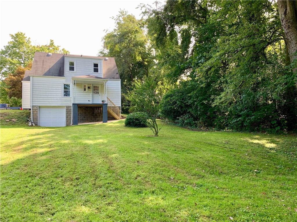 401 Bechman Street Springdale, PA 15144 - Photo 25 of 25 Rear of home showing 1 car integral garage though there is no access, but great for the tractor or workshop! Nice covered porch!