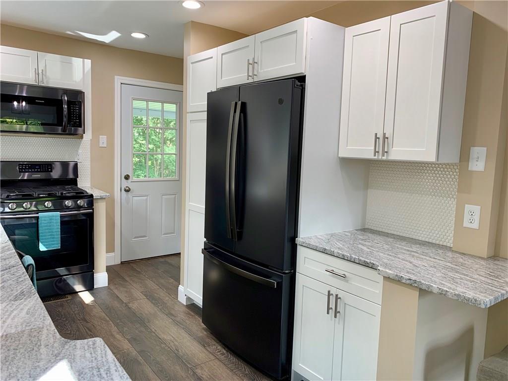 401 Bechman Street Springdale, PA 15144 - Photo 9 of 25 View of kitchen showing rear entry onto covered rear porch!