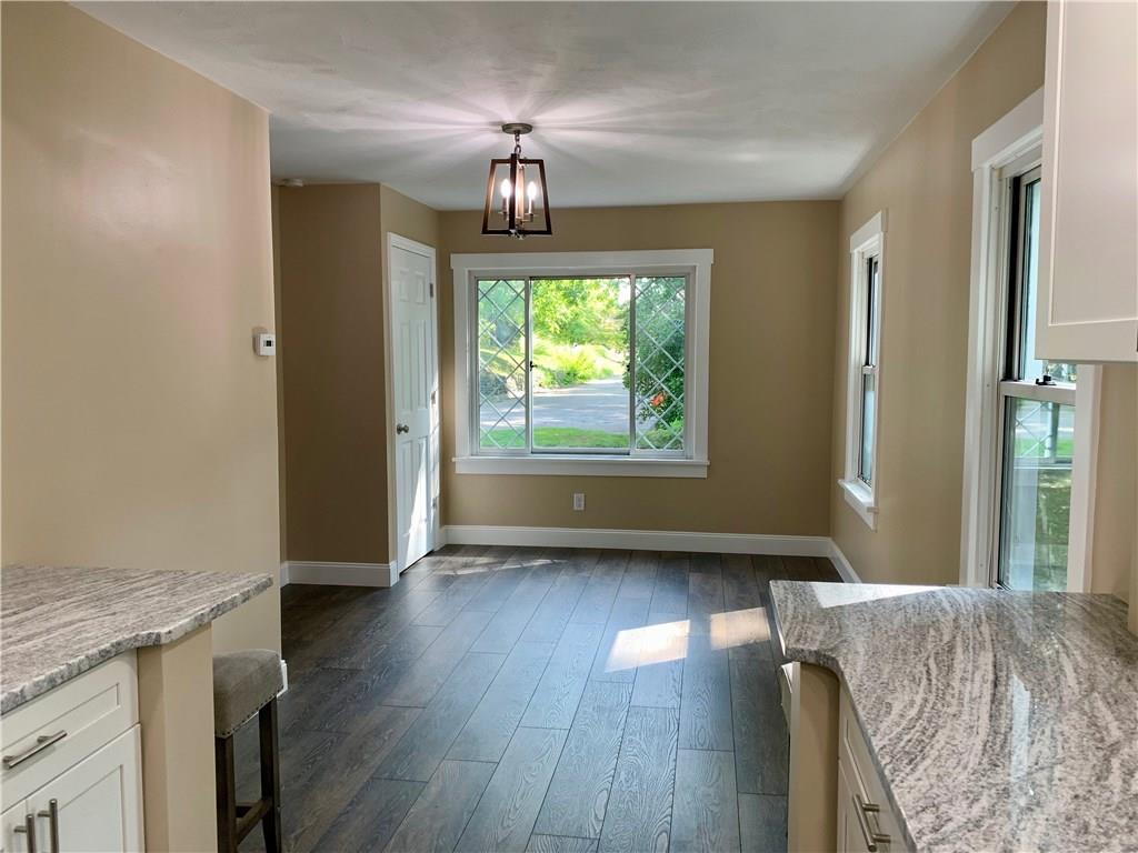 401 Bechman Street Springdale, PA 15144 - Photo 10 of 25 View from kitchen into open concept dining room area with newly installed closet! So much natural sunlight!