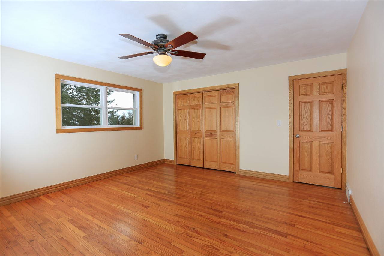4010 North Meridian Road Rockford, IL 61101 - Photo 10 of 25 a view of empty room with wooden floor and window