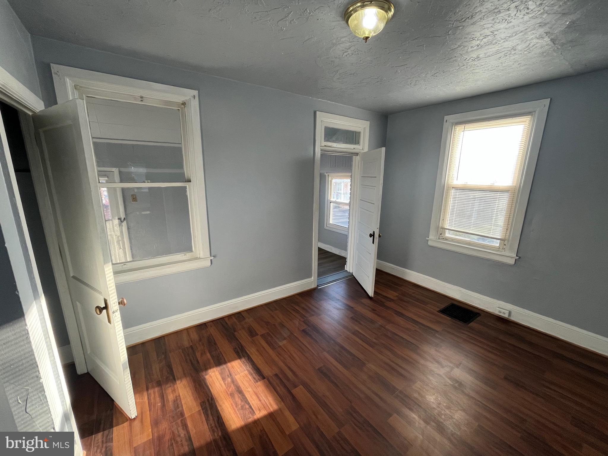 240 Harding Court York, PA 17403 - Photo 18 of 31 an empty room with wooden floor and windows