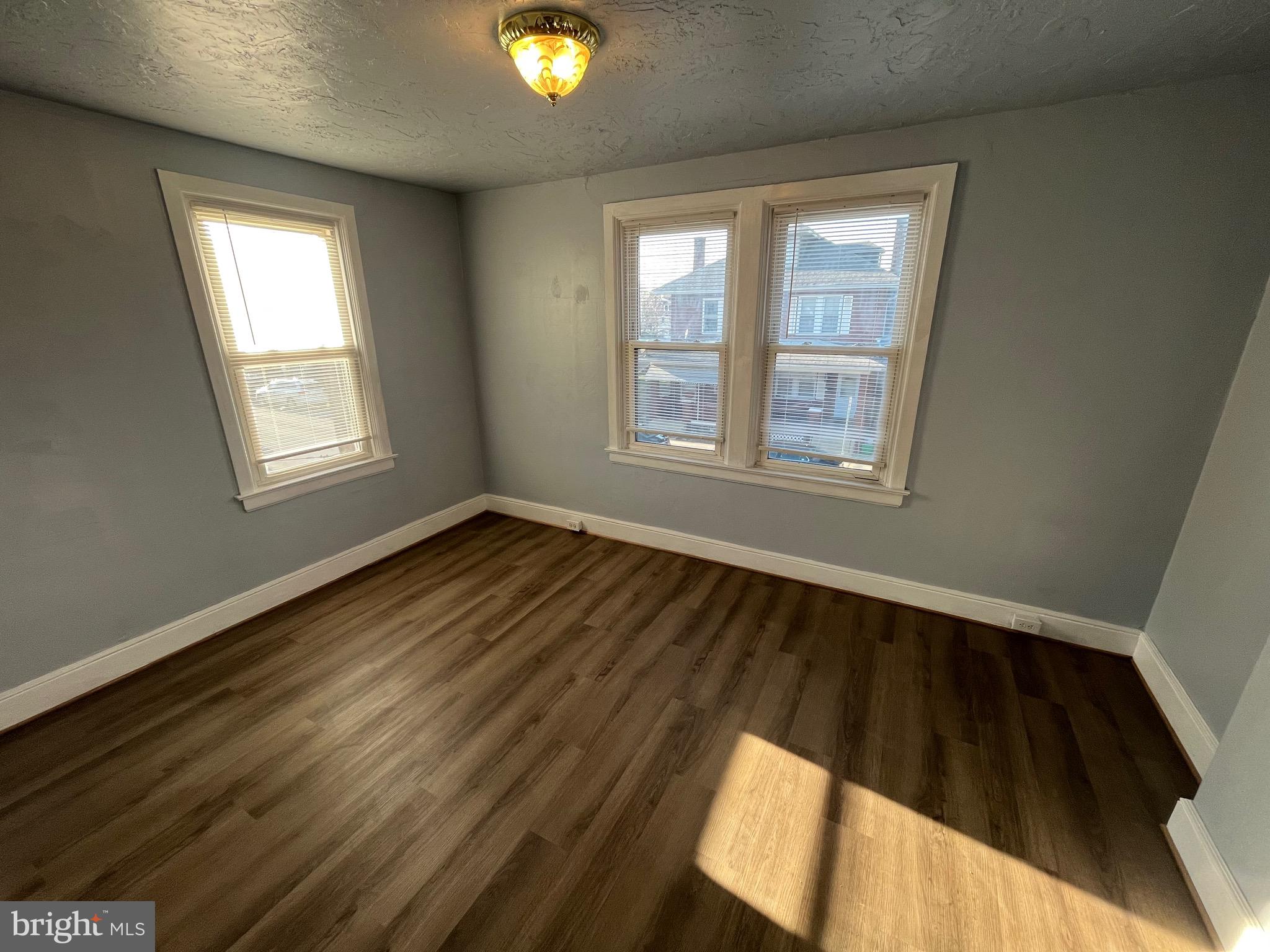 240 Harding Court York, PA 17403 - Photo 21 of 31 a view of an empty room with wooden floor and a window