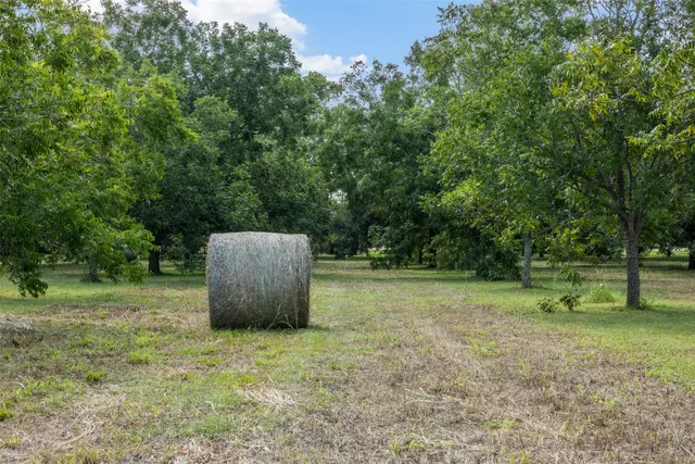 a backyard view with a seating space