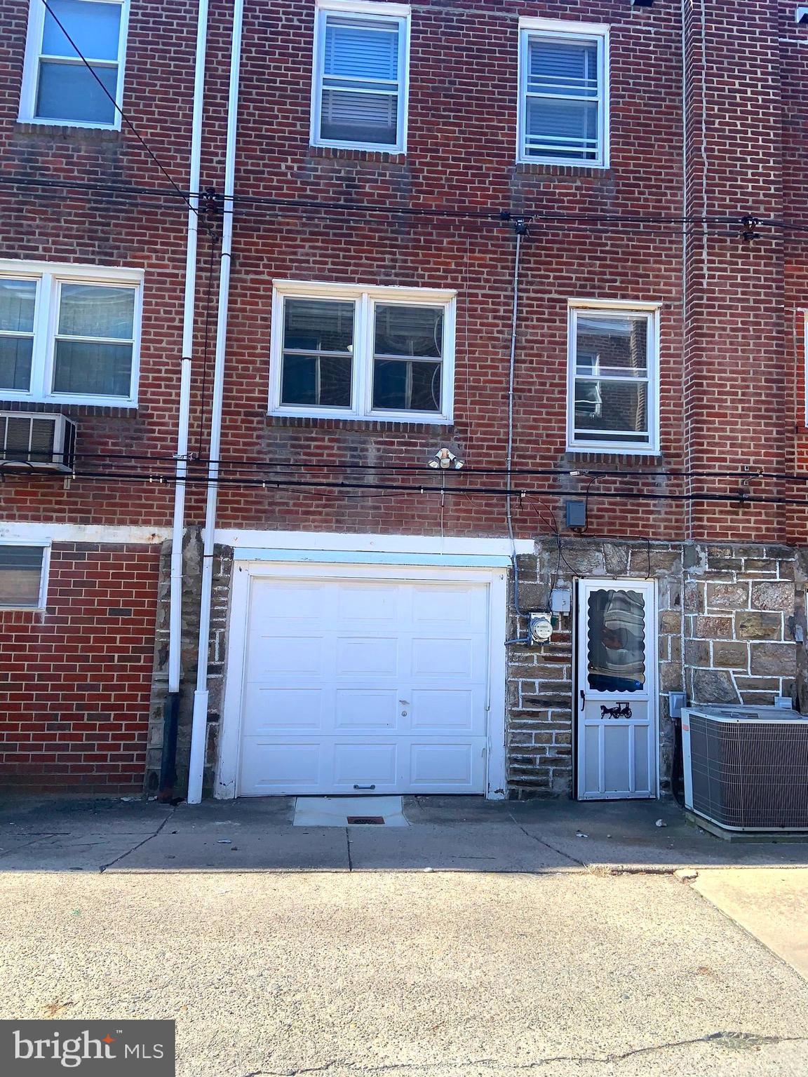 4613 Hartel Avenue Philadelphia, PA 19136 - Photo 17 of 17 a view of a brick house with many windows