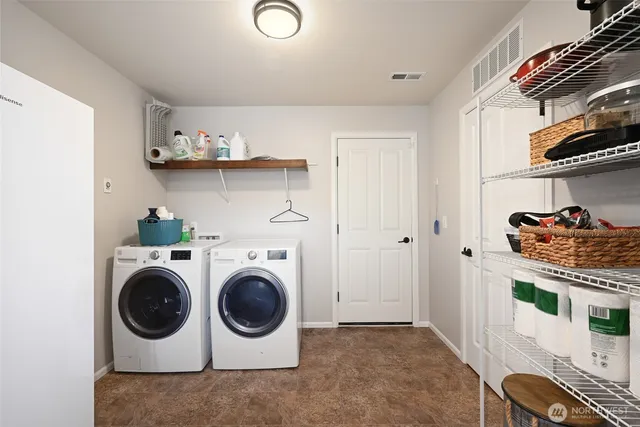 a utility room with dryer and washer