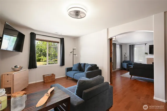 a living room with furniture and a window