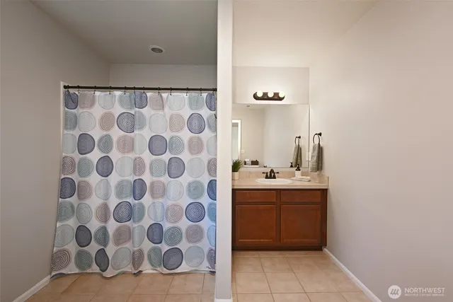 a bathroom with a sink and mirror