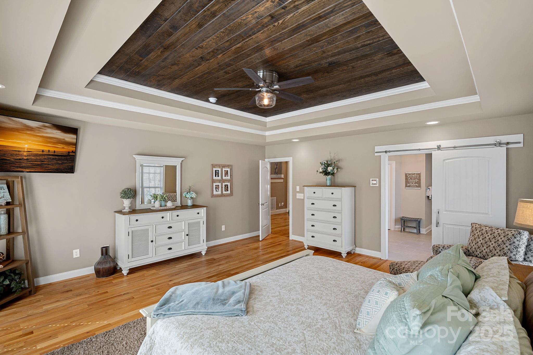 105 Elizabeth Brook Drive Davidson, NC 28036 - Photo 13 of 43 a bedroom with furniture and a chandelier