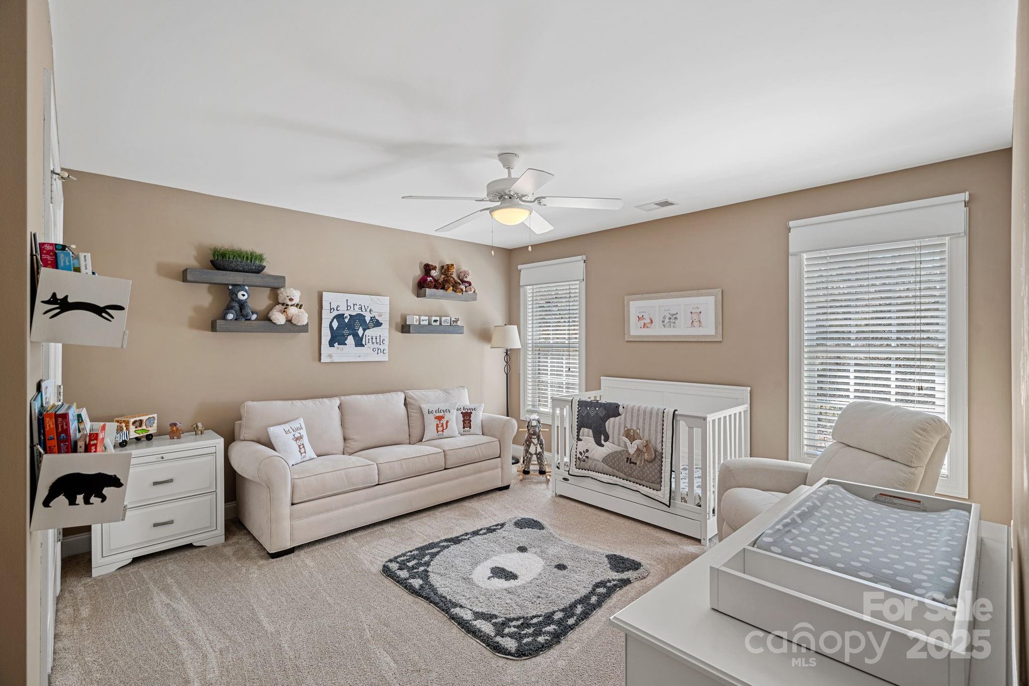 105 Elizabeth Brook Drive Davidson, NC 28036 - Photo 23 of 43 a living room with furniture and a fireplace