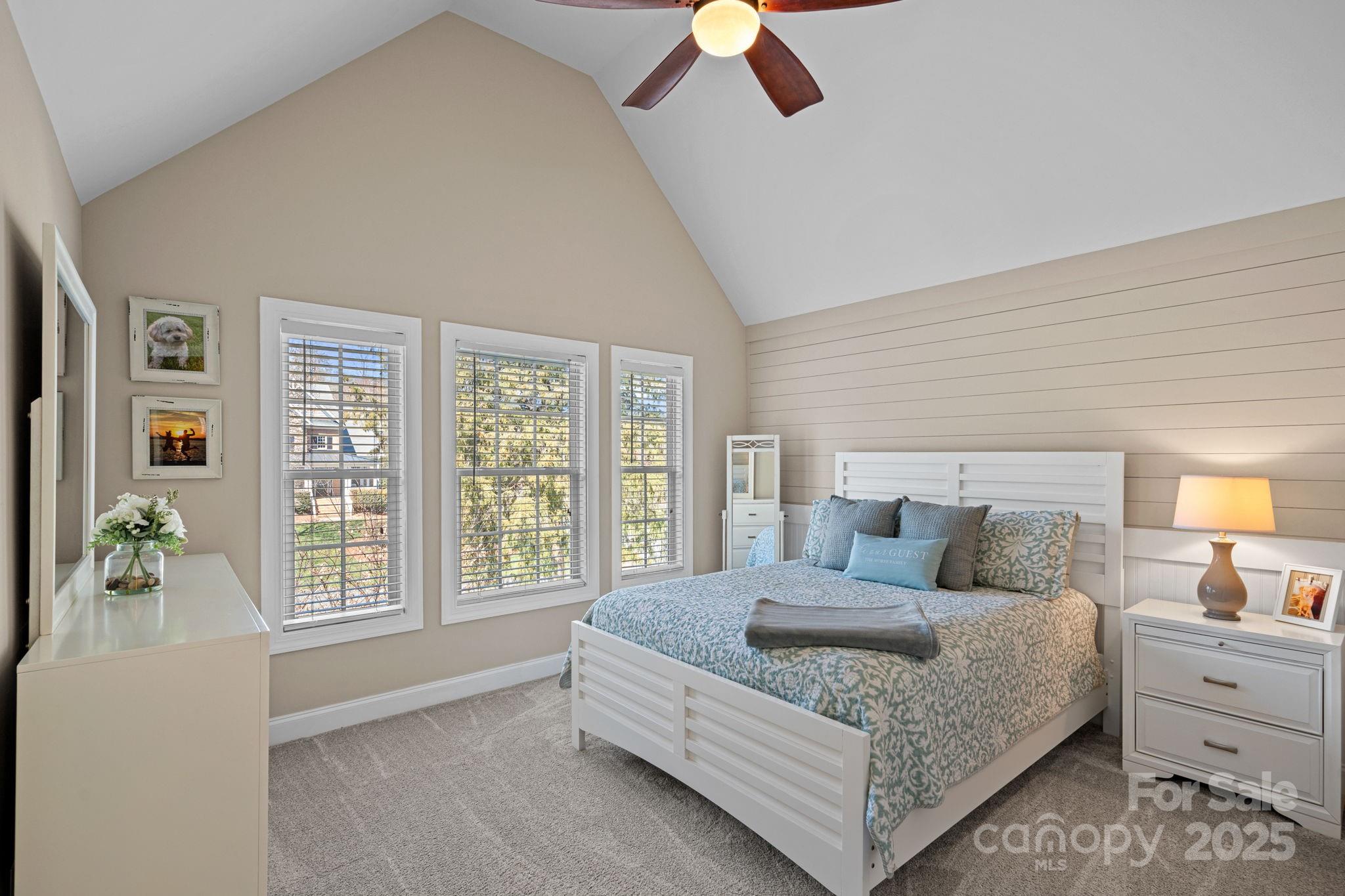 105 Elizabeth Brook Drive Davidson, NC 28036 - Photo 25 of 43 a bedroom with a large bed and a large window