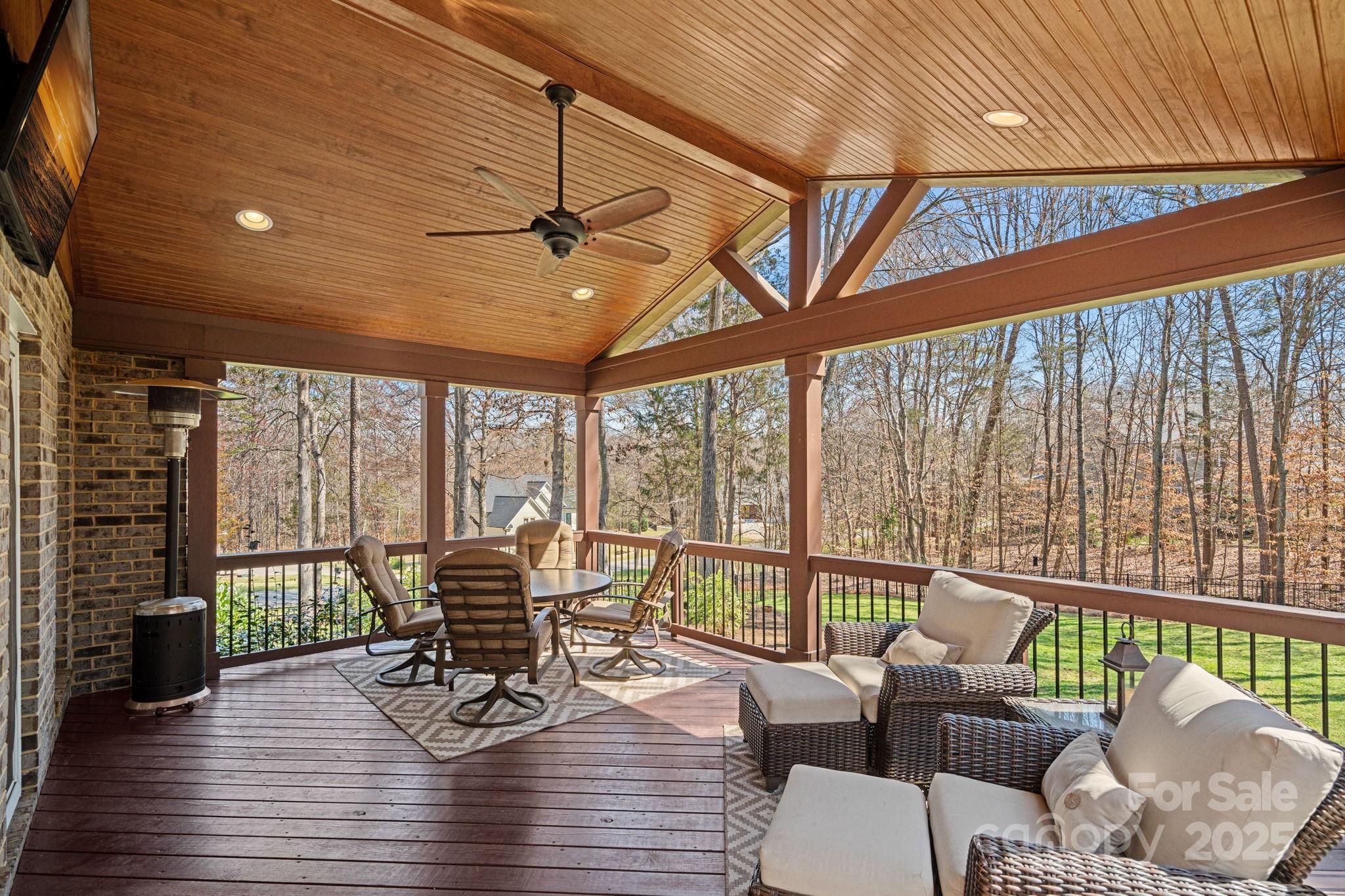 105 Elizabeth Brook Drive Davidson, NC 28036 - Photo 30 of 43 a living room with furniture floor to ceiling windows and wooden floor