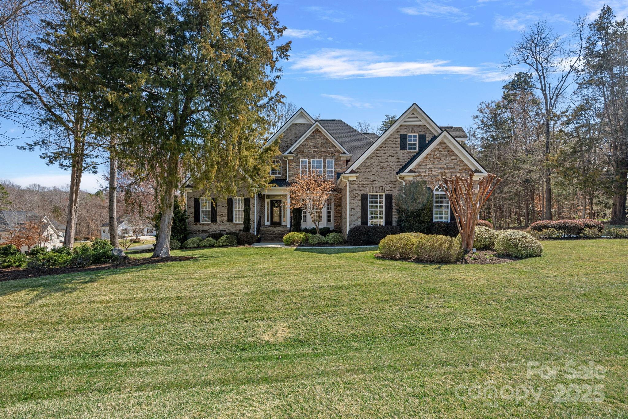 105 Elizabeth Brook Drive Davidson, NC 28036 - Photo 39 of 43 a view of a house with a big yard and large trees
