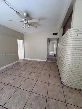 a view of a livingroom with furniture and chandelier