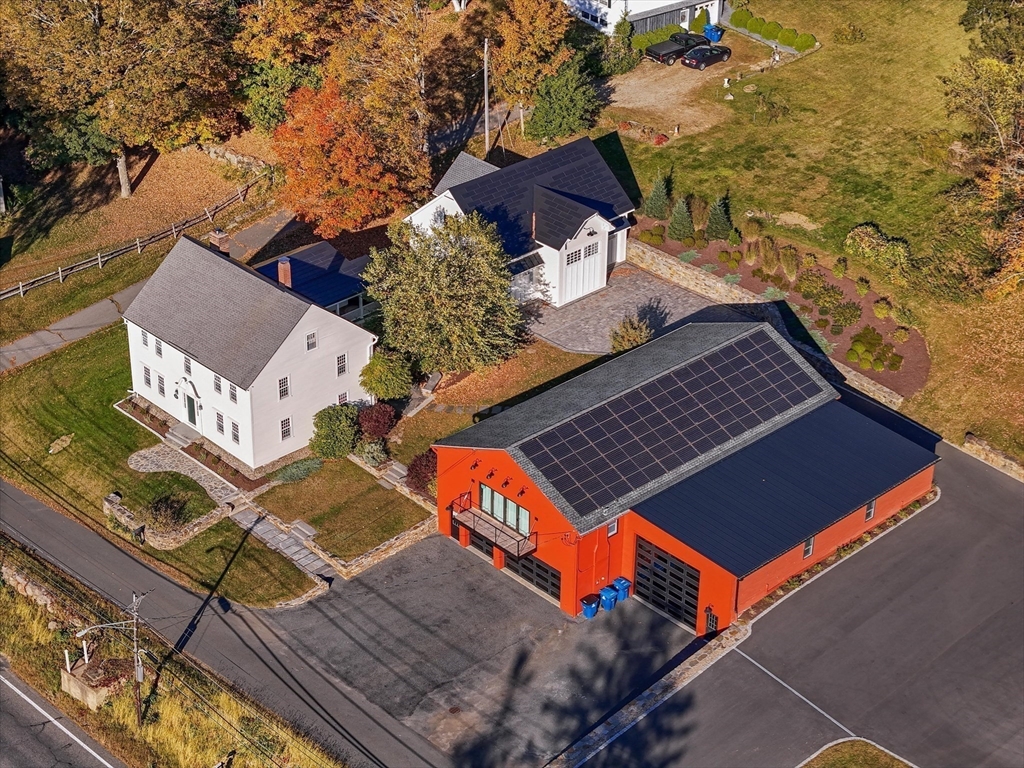 an aerial view of houses with yard