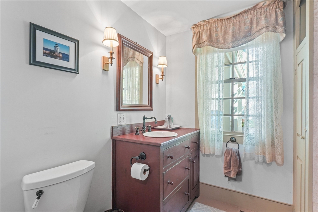 21 Sturbridge Road Brimfield, MA 01010 - Photo 12 of 41 a bathroom with a sink a toilet and a window