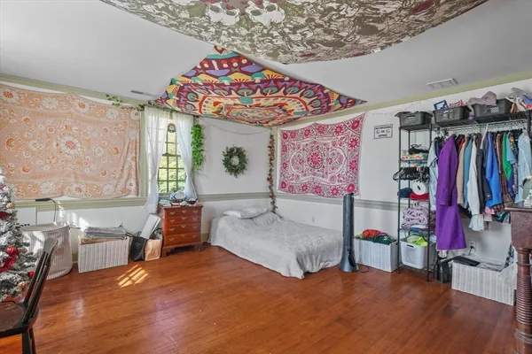 a view of backyard with outdoor seating and trees