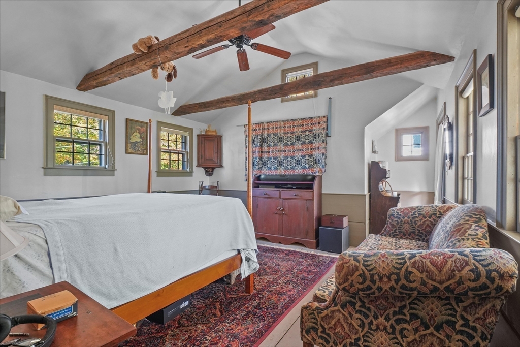 21 Sturbridge Road Brimfield, MA 01010 - Photo 24 of 41 a bedroom with a bed and wooden floor