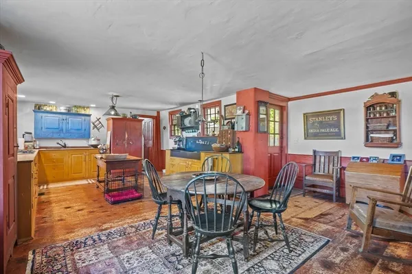 a kitchen with granite countertop sink cabinets and refrigerator
