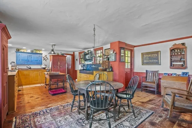 a kitchen with granite countertop sink cabinets and refrigerator