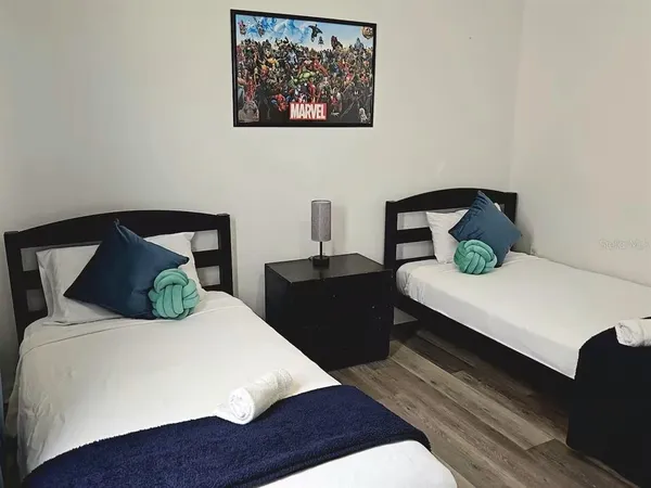 a bedroom with a bed and a table