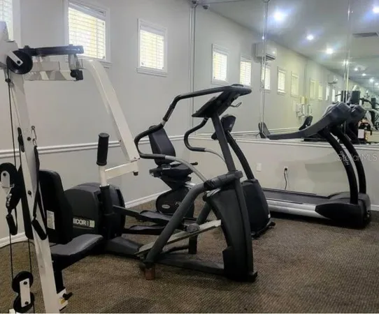 a view of a room with gym equipment