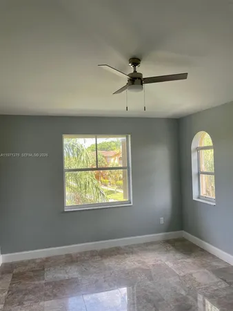 a view of an empty room with a window