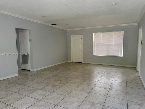 a view of an empty room and window
